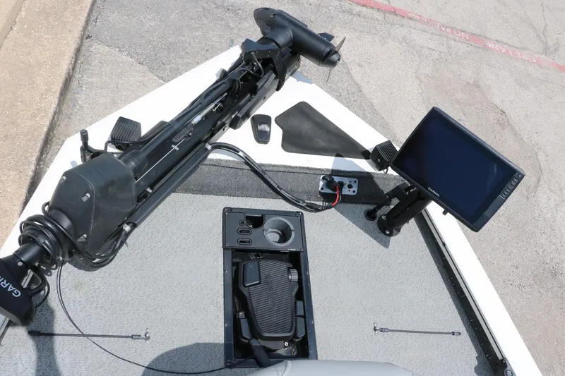 Slide: The Image of 2018 Tracker Pro Team 195 TXW boat deck with Garmin fishfinder and trolling motor. - 17
