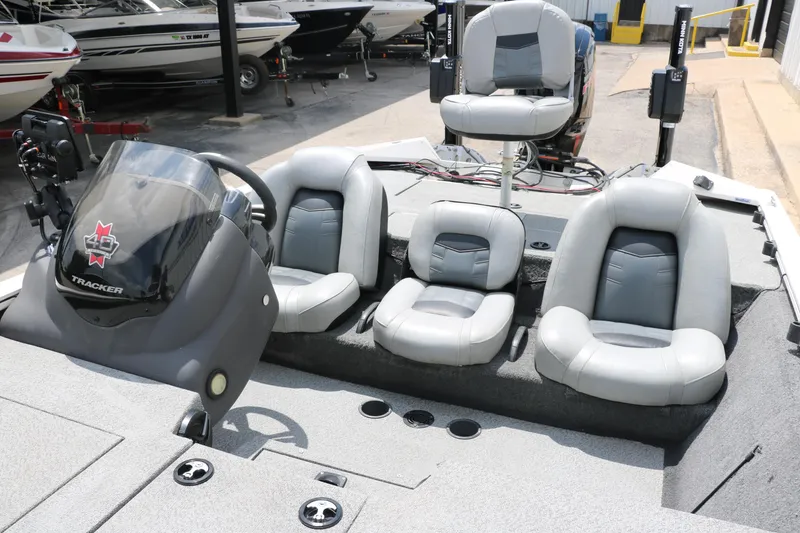 Slide: The Image of 2018 Tracker Pro Team 195 TXW 40th Anniversary Edition boat interior with seating and console. - 22