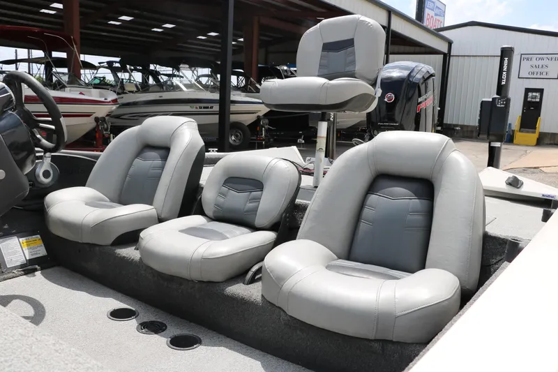 Slide: The Image of 2018 Tracker Pro Team 195 TXW boat interior with gray seating, showroom background. - 25