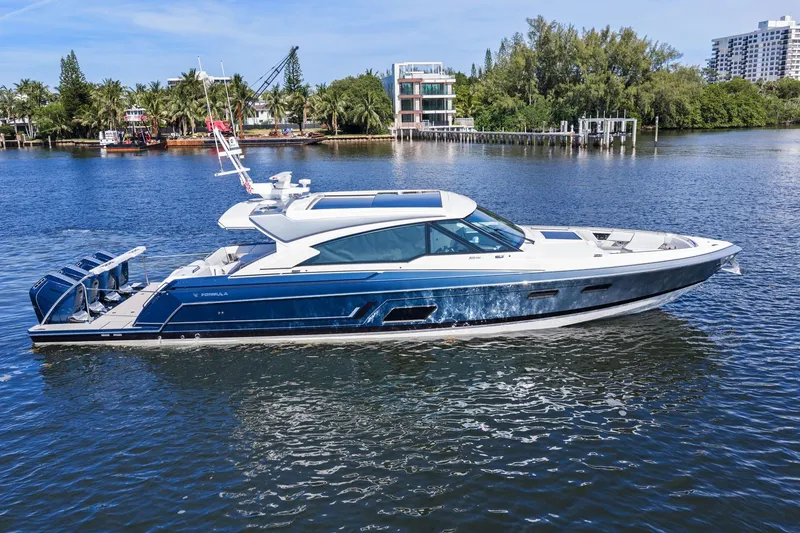 The Image of 2025 Formula 500 Super Sport Crossover yacht cruising on a serene waterway. - 1