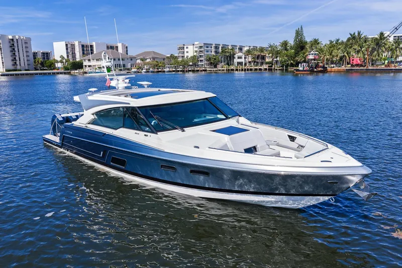 Slide: The Image of 2025 Formula 500 Super Sport Crossover yacht on a sunny waterfront. - 10