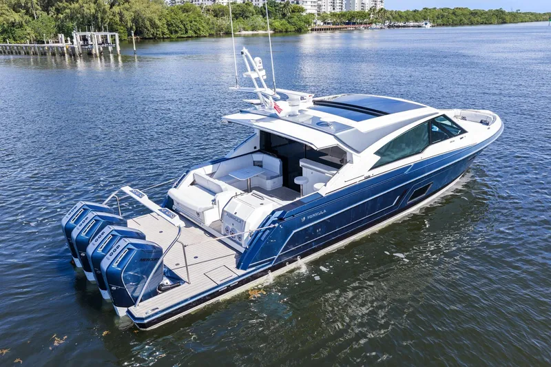 Slide: The Image of 2025 Formula 500 Super Sport Crossover luxury boat cruising on a serene lake. - 11