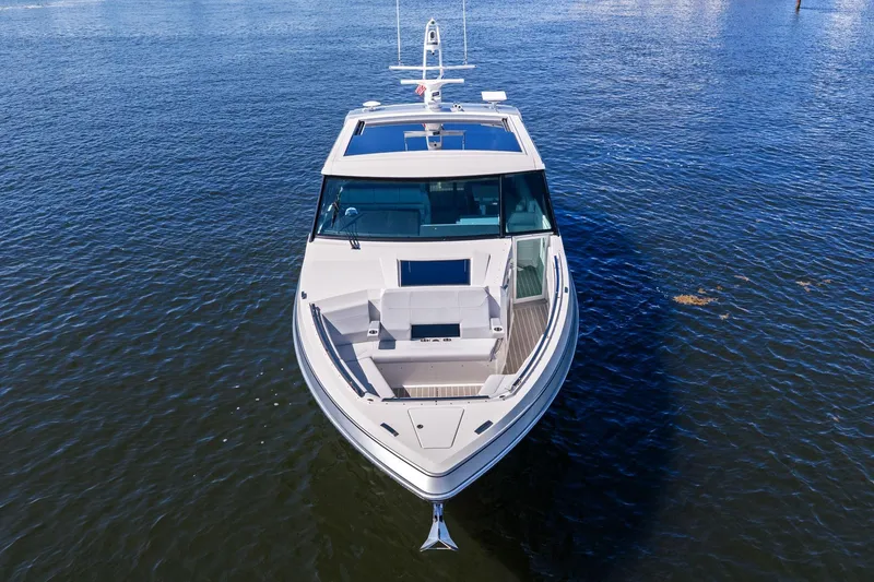 Slide: The Image of 2025 Formula 500 Super Sport Crossover boat on calm water, aerial view. - 12