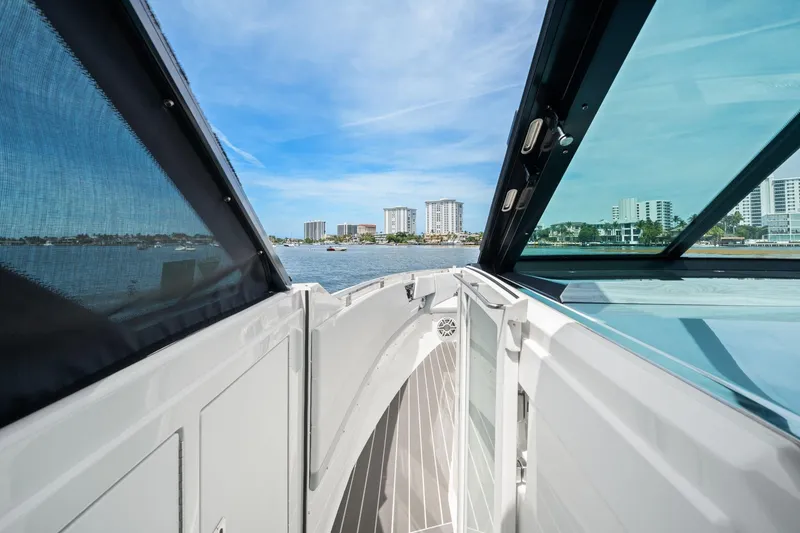Slide: The Image of 2025 Formula 500 Super Sport Crossover yacht with city skyline and blue sky backdrop. - 17