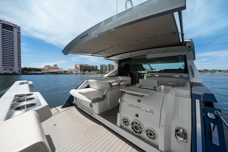 Slide: The Image of 2025 Formula 500 Super Sport Crossover yacht with luxurious deck and waterfront view. - 19