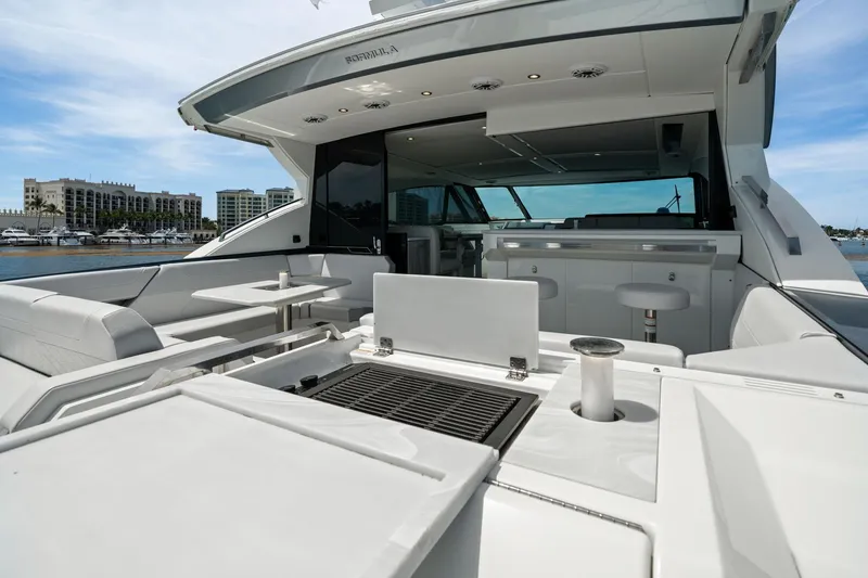 Slide: The Image of 2025 Formula 500 Super Sport Crossover yacht with luxurious deck and seating area. - 20