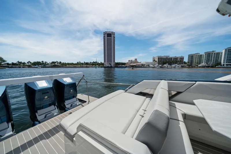 Slide: The Image of 2025 Formula 500 Super Sport Crossover yacht with luxurious seating, overlooking waterfront skyline. - 24