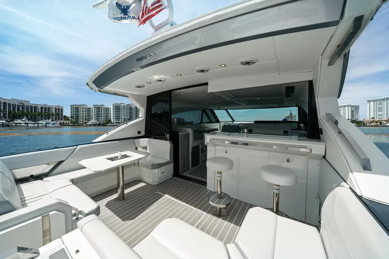 Slide: The Image of Luxury 2025 Formula 500 Super Sport Crossover yacht interior with sleek seating and modern design. - 25