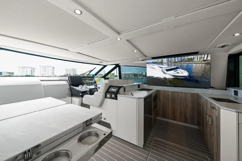 Slide: The Image of Interior of 2025 Formula 500 Super Sport Crossover yacht with modern design and large windows. - 26