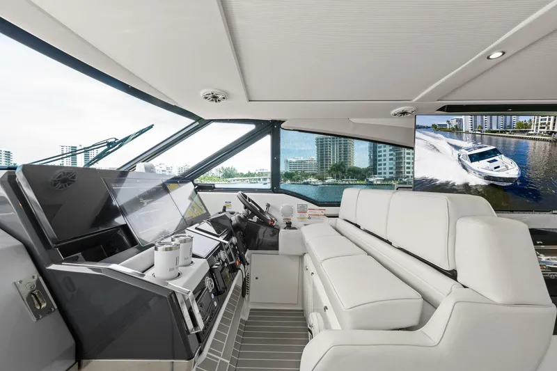 Slide: The Image of Interior of 2025 Formula 500 Super Sport Crossover yacht with modern helm and luxurious seating. - 27