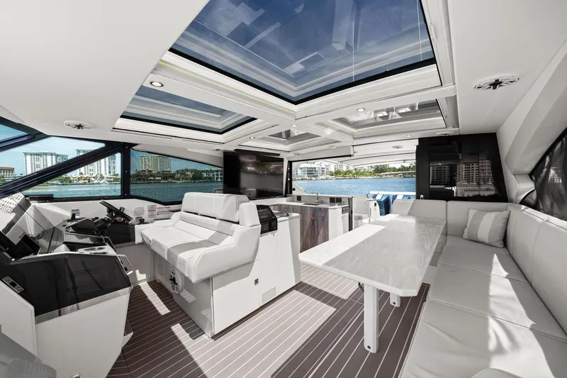 Slide: The Image of Luxurious interior of 2025 Formula 500 Super Sport Crossover yacht with panoramic windows and seating. - 28