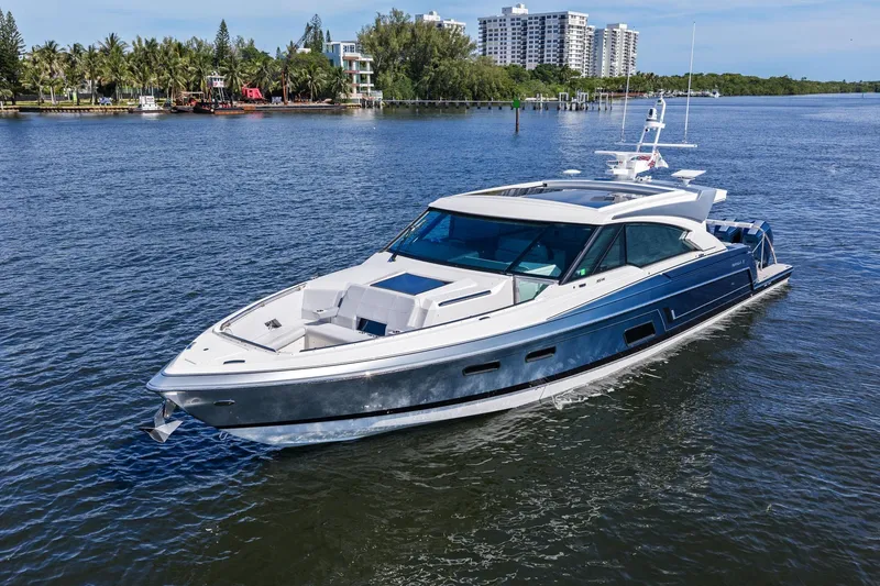 Slide: The Image of 2025 Formula 500 Super Sport Crossover yacht cruising on a scenic waterway. - 3