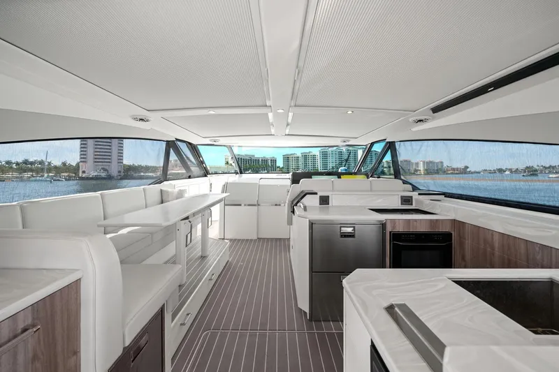 Slide: The Image of Luxurious interior of 2025 Formula 500 Super Sport Crossover yacht with modern kitchen and seating. - 31