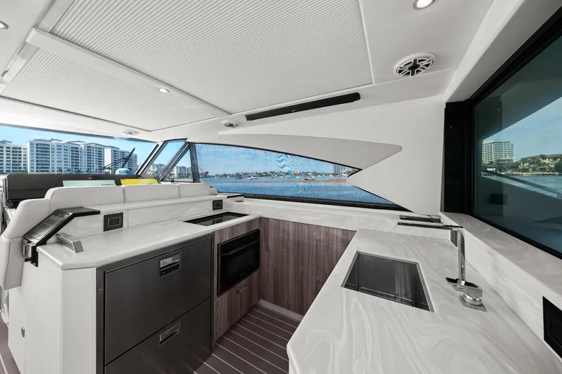 Slide: The Image of Luxurious interior of 2025 Formula 500 Super Sport Crossover yacht with modern kitchen amenities. - 32