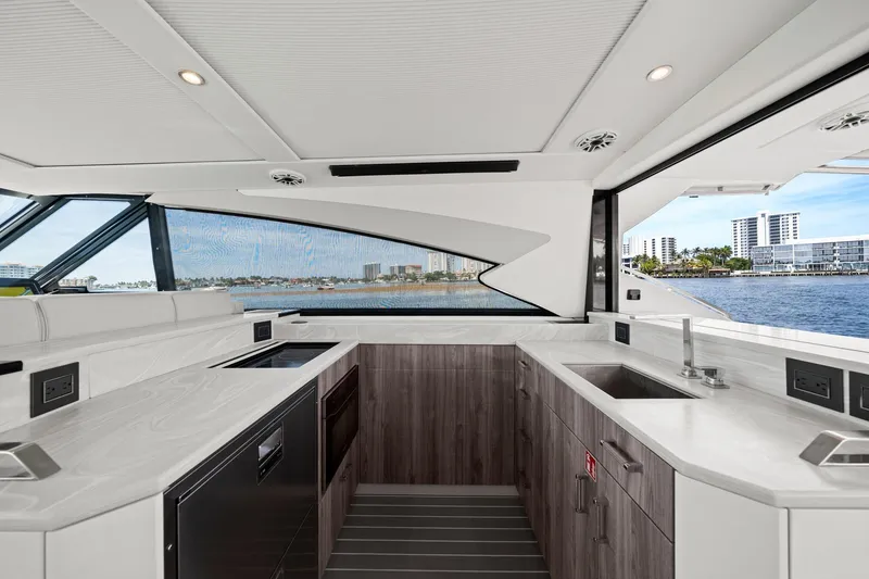 Slide: The Image of Luxurious interior of 2025 Formula 500 Super Sport Crossover yacht with modern kitchen design. - 33