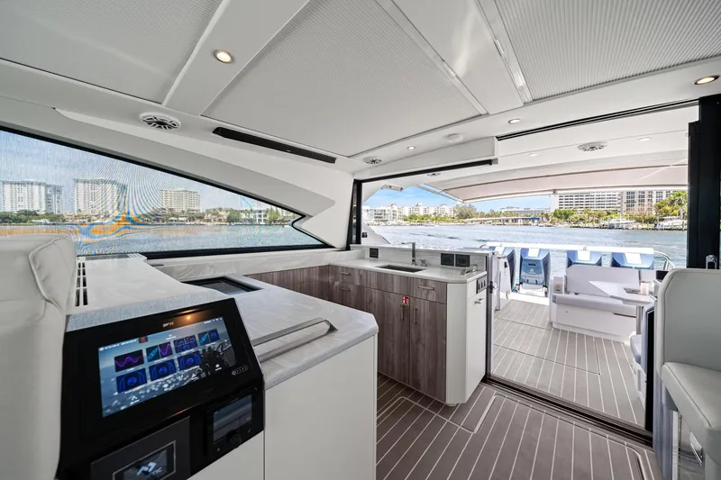 Slide: The Image of Luxurious interior of 2025 Formula 500 Super Sport Crossover yacht with modern amenities and waterfront view. - 34