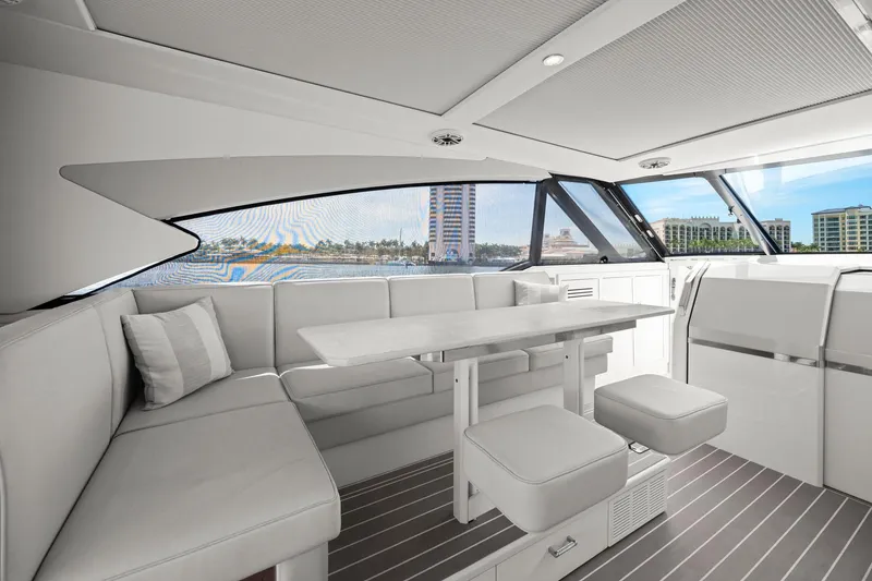 Slide: The Image of Luxurious interior of 2025 Formula 500 Super Sport Crossover yacht with elegant seating and table. - 36