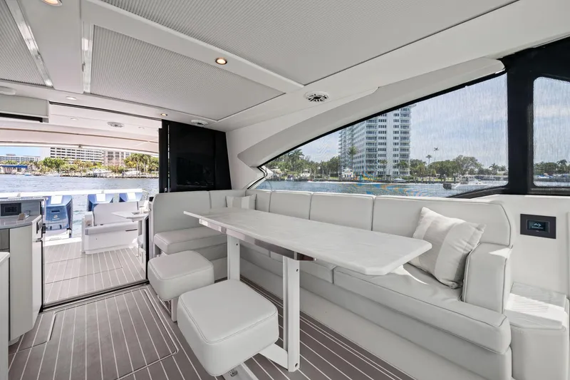 Slide: The Image of Luxurious interior of 2025 Formula 500 Super Sport Crossover yacht with elegant seating and waterfront view. - 37