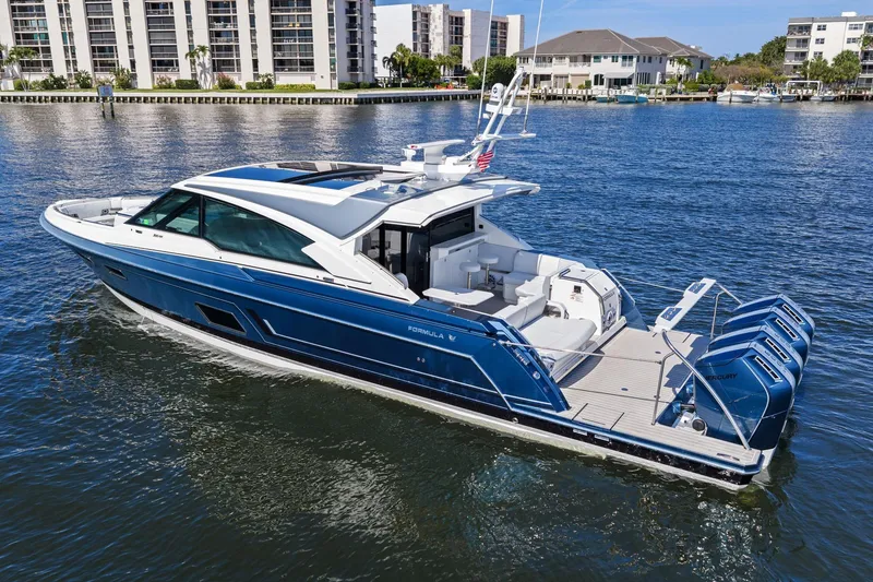 Slide: The Image of 2025 Formula 500 Super Sport Crossover yacht cruising on a sunny waterfront. - 4