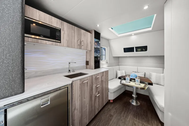 Slide: The Image of Luxurious interior of 2025 Formula 500 Super Sport Crossover with modern kitchen and seating area. - 41