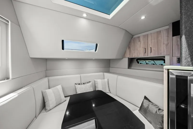 Slide: The Image of Luxurious interior of 2025 Formula 500 Super Sport Crossover yacht with modern seating and skylight. - 44
