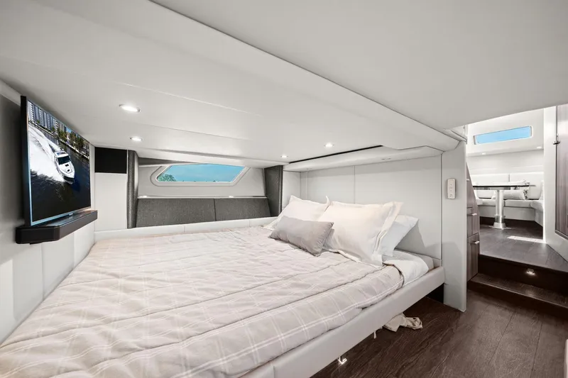 Slide: The Image of Luxurious cabin interior of 2025 Formula 500 Super Sport Crossover yacht with bed and TV. - 54