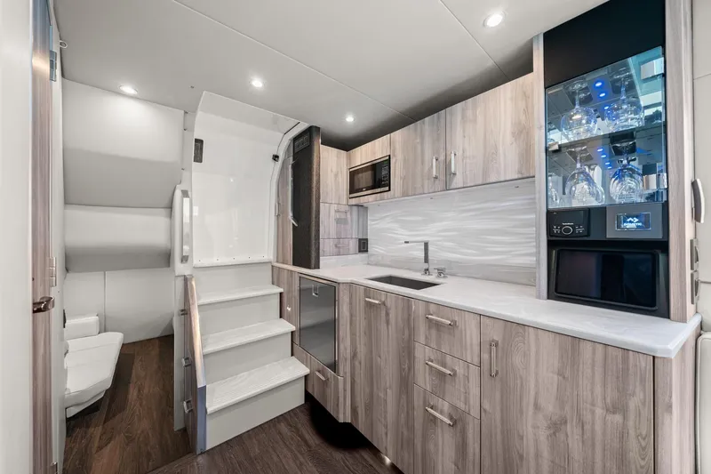 Slide: The Image of Luxurious interior of 2025 Formula 500 Super Sport Crossover with modern kitchen amenities. - 55