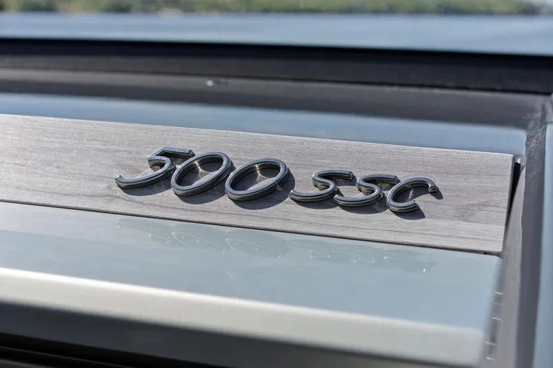 Slide: The Image of 2025 Formula 500 Super Sport Crossover emblem on sleek metallic surface. - 57