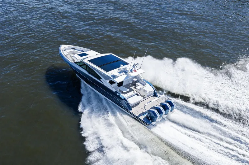 Slide: The Image of 2025 Formula 500 Super Sport Crossover speeding on open water, showcasing sleek design and powerful engines. - 72