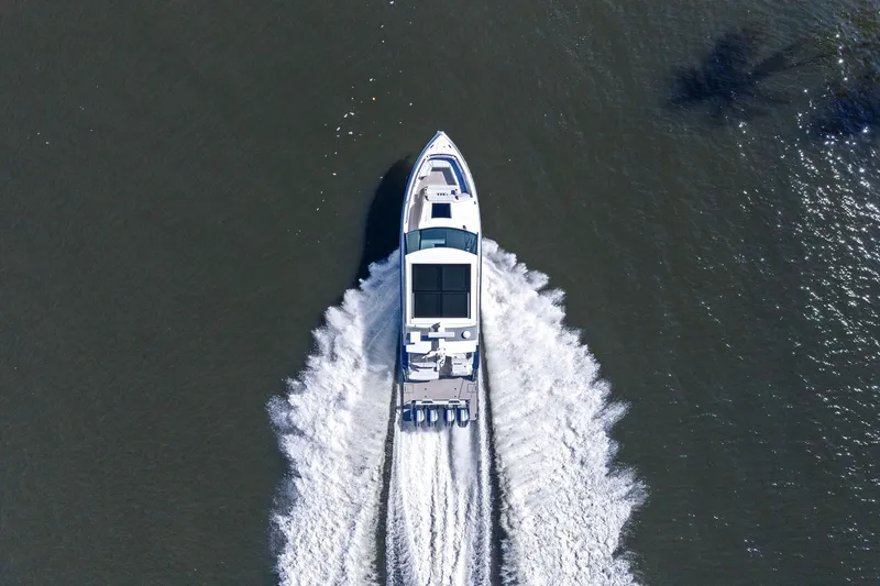 Slide: The Image of Aerial view of 2025 Formula 500 Super Sport Crossover boat cruising on water. - 73