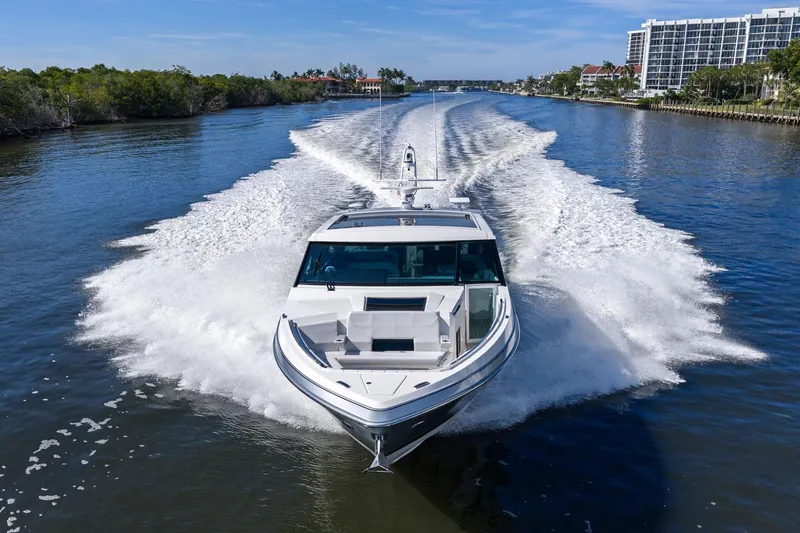Slide: The Image of 2025 Formula 500 Super Sport Crossover cruising on a scenic waterway. - 77
