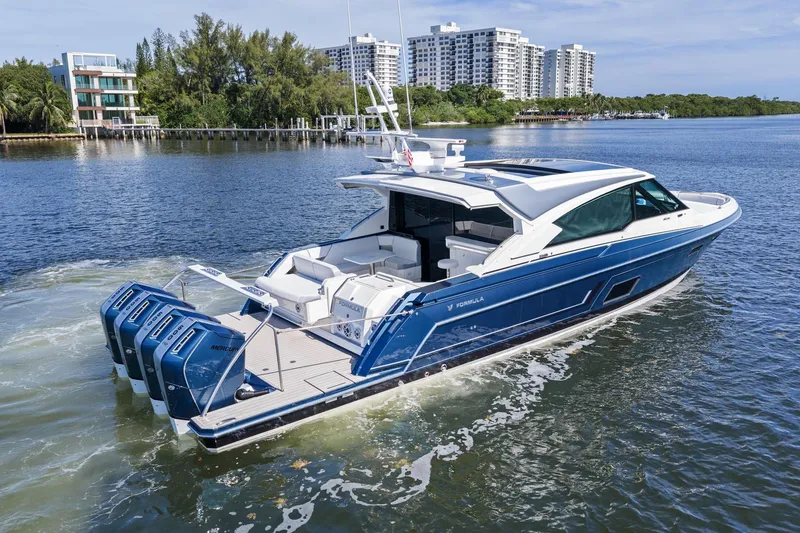 Slide: The Image of 2025 Formula 500 Super Sport Crossover luxury yacht cruising on a scenic waterway. - 9