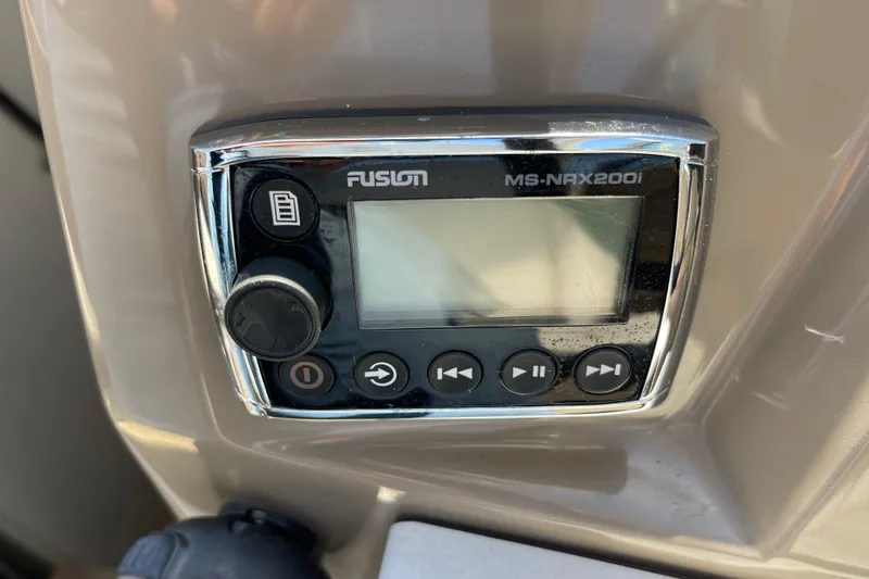 Slide: The Image of Fusion MS-NRX200i stereo control on 2016 Regal 28 Express boat dashboard. - 12