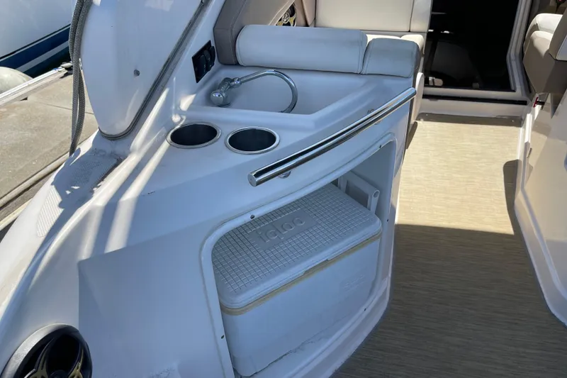 Slide: The Image of Interior of a 2016 Regal 28 Express boat featuring a sink and storage area. - 5
