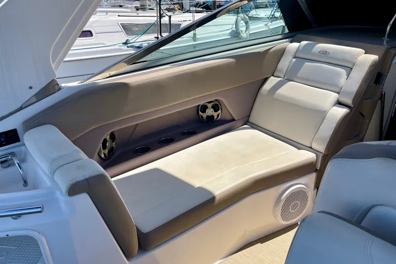 Slide: The Image of Luxurious seating area on a 2016 Regal 28 Express boat, featuring comfortable cushions. - 8
