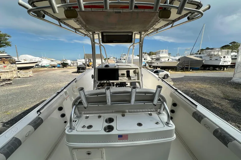 Slide: The Image of 2011 Sailfish 2660 CC boat interior with rod holders and control panel. - 14