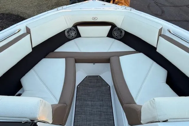 Slide: The Image of 2022 Cobalt CS22 boat interior with white and brown seating. - 21