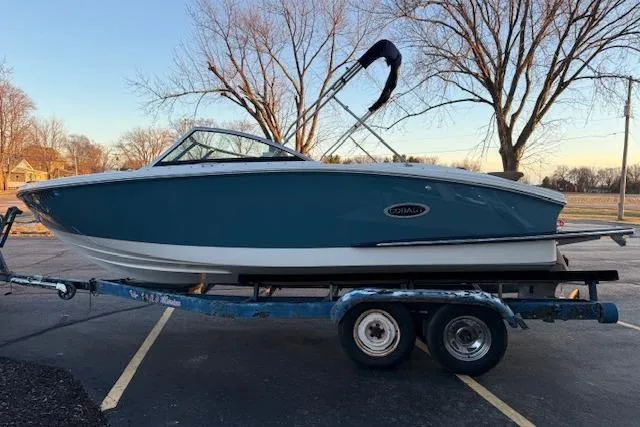 Slide: The Image of 2022 Cobalt CS22 boat on trailer in parking lot, side view. - 3