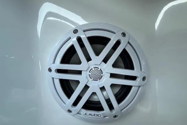 Slide: The Image of White JL Audio speaker on 2022 Cobalt CS22 boat interior. - 31