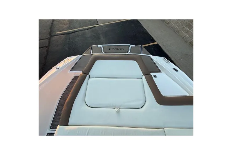 Slide: The Image of 2022 Cobalt CS22 boat with sleek white and brown upholstery, viewed from above. - 32