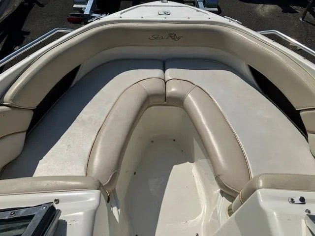 Slide: The Image of 1997 Sea Ray 190 Bow Rider boat interior with beige seating. - 7