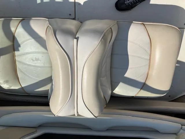 Slide: The Image of 1997 Sea Ray 190 Bow Rider boat seats in white upholstery. - 9