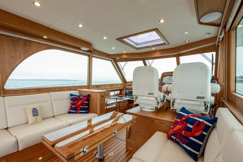 Slide: The Image of Luxurious interior of 2026 Sabre 45 Salon Express yacht with plush seating and nautical decor. - 10