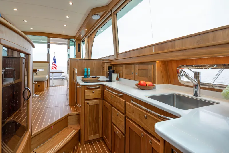 Slide: The Image of Luxurious interior of 2026 Sabre 45 Salon Express yacht with modern kitchen amenities. - 14