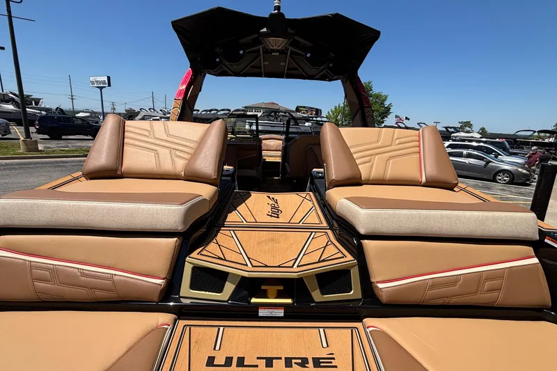 Slide: The Image of 2026 Tigé Ultré 25ZX boat interior with luxurious tan seating and stylish design. - 12