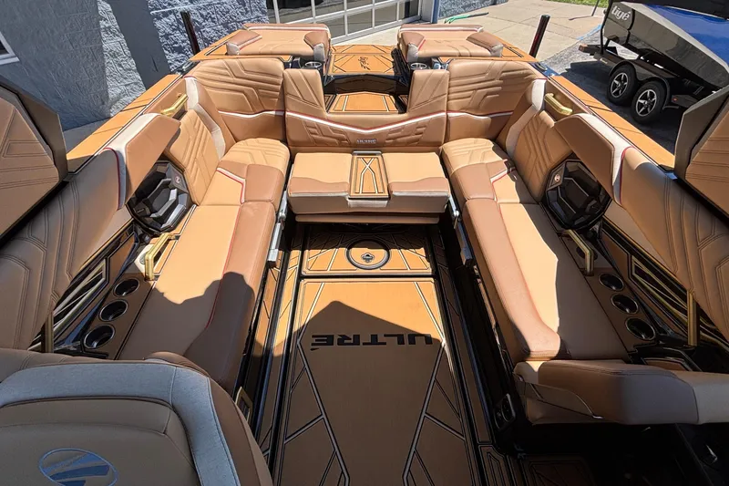 Slide: The Image of Luxurious interior of 2026 Tigé Ultré 25ZX boat with tan leather seating. - 15