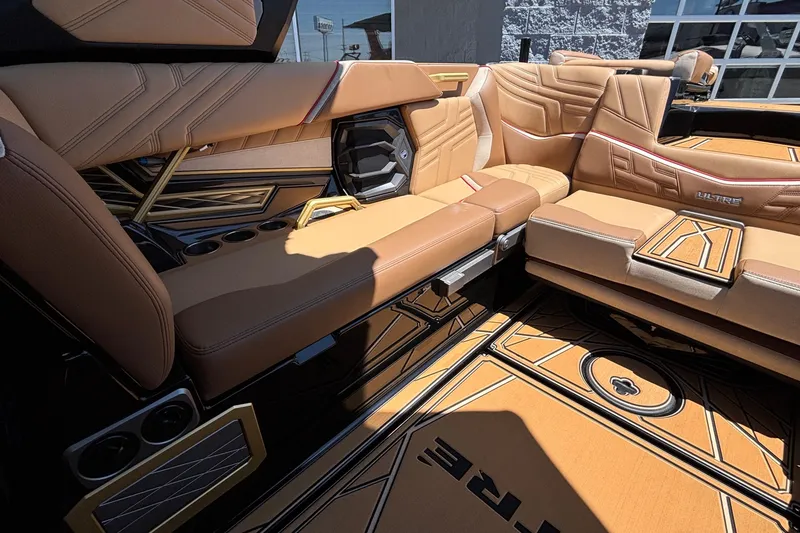Slide: The Image of Luxurious interior of 2026 Tigé Ultré 25ZX boat with tan leather seating and stylish design. - 16