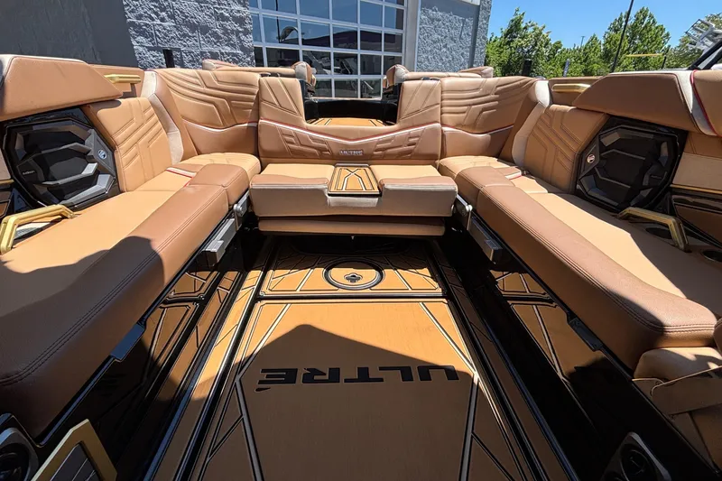 Slide: The Image of Luxurious interior of 2026 Tigé Ultré 25ZX boat with tan leather seating. - 17
