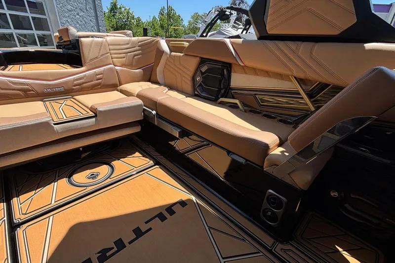 Slide: The Image of Luxurious interior of 2026 Tigé Ultré 25ZX boat with tan leather seating and sleek design. - 18