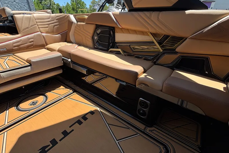 Slide: The Image of 2026 Tigé Ultré 25ZX boat interior with luxurious tan seating and stylish design. - 19